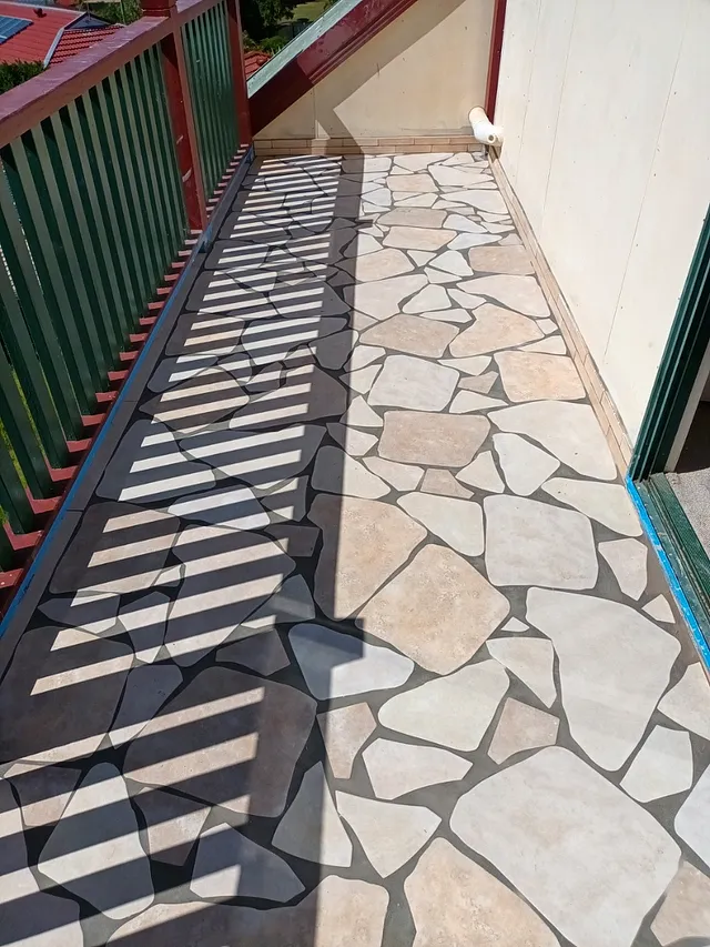 Balcony floor tiled with crazy-paving style pieces